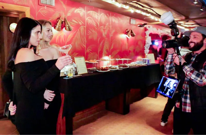 Roaming photographer capturing candid group photos at a live event