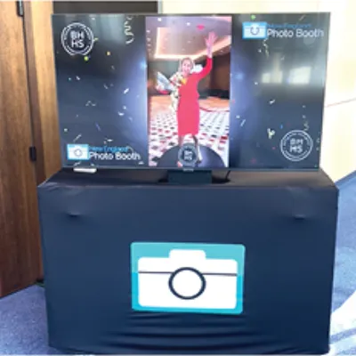 TV slideshow display showing live photo booth photos